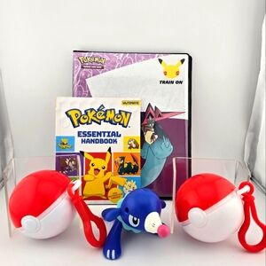 Pokemom Bundle. 2 empty Pokeball, 1 figure, 1 trading card album, 1 book.